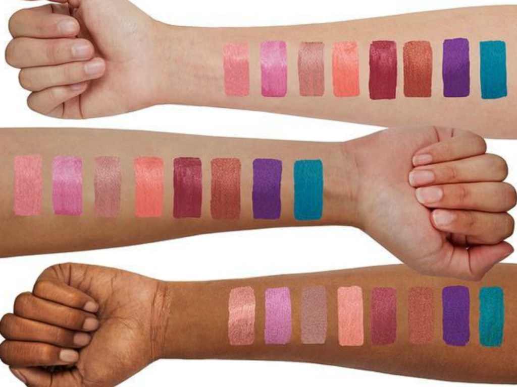 arms with metallic make up painted on them in lines