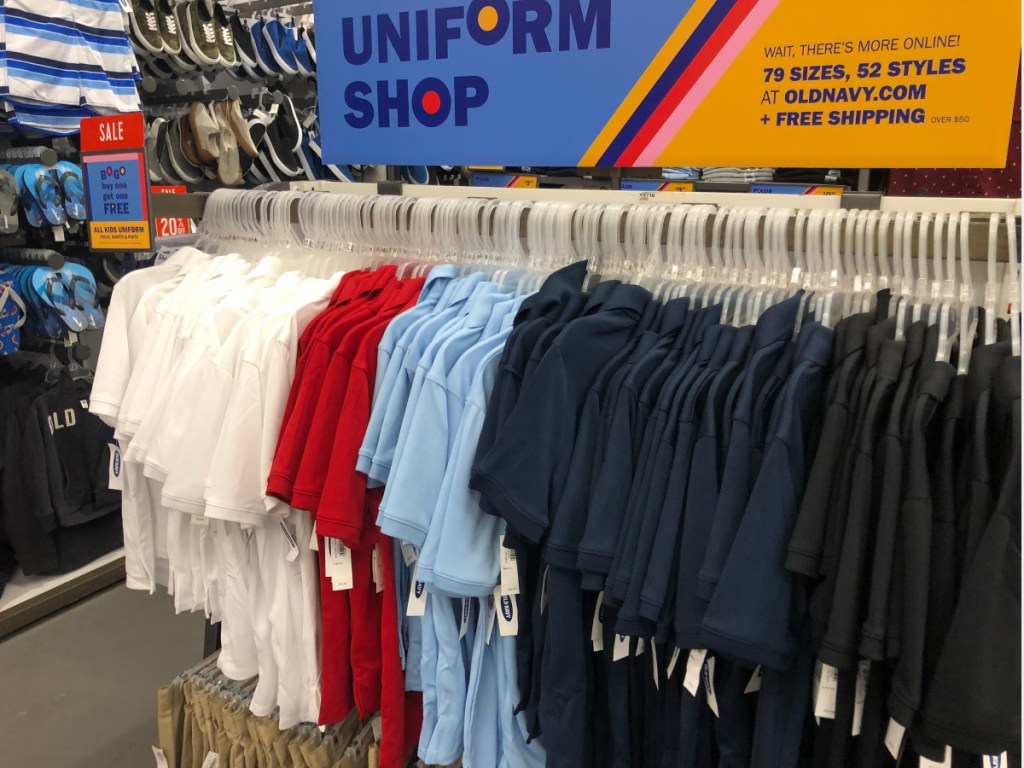 old navy polo uniform shirts on rack in store