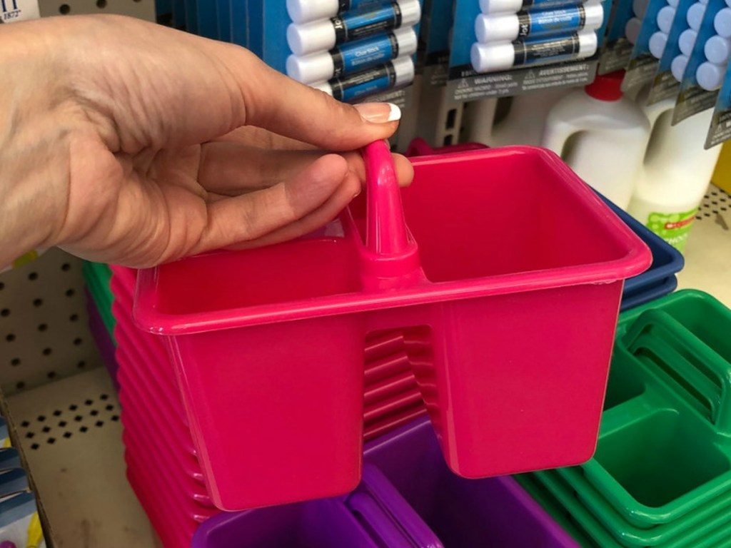 hand holding pink pencil caddy in store