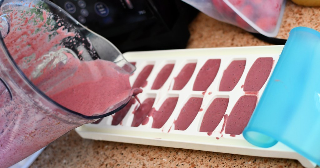 pouring smoothie into an ice cube tray