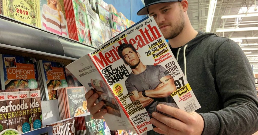 man reading Men's Health magazine 