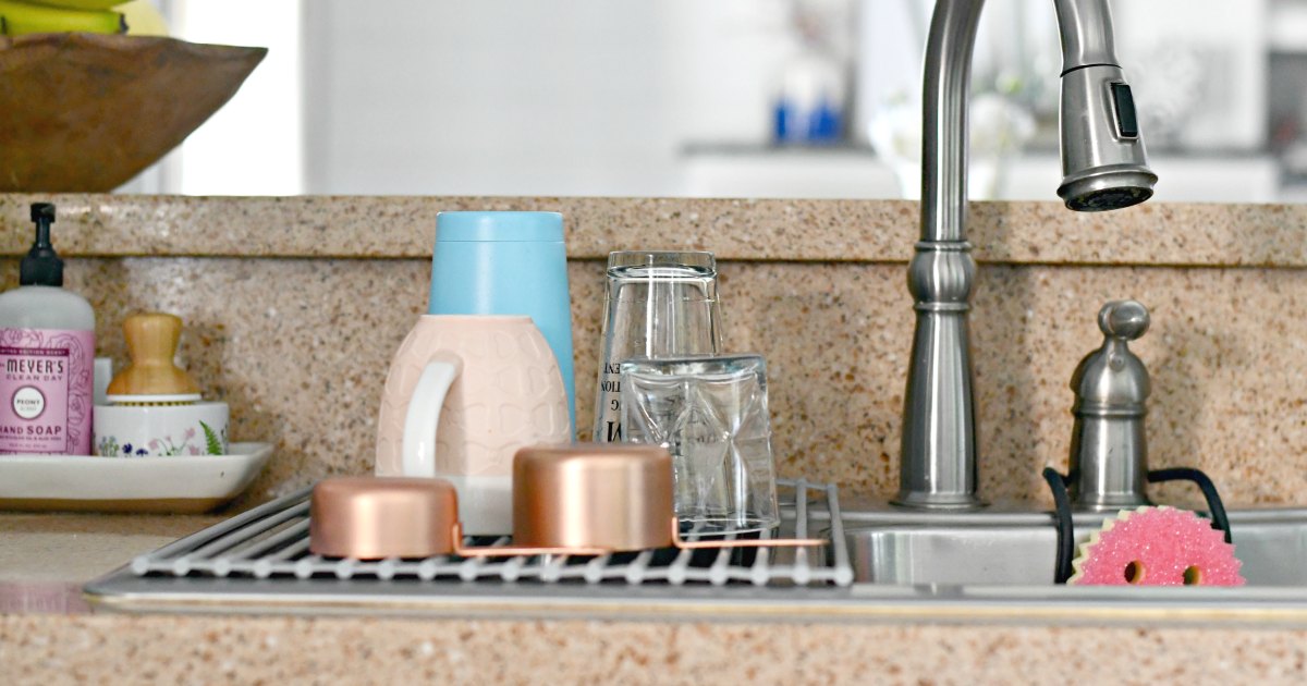 roll-up kitchen sink mat with dishes drying