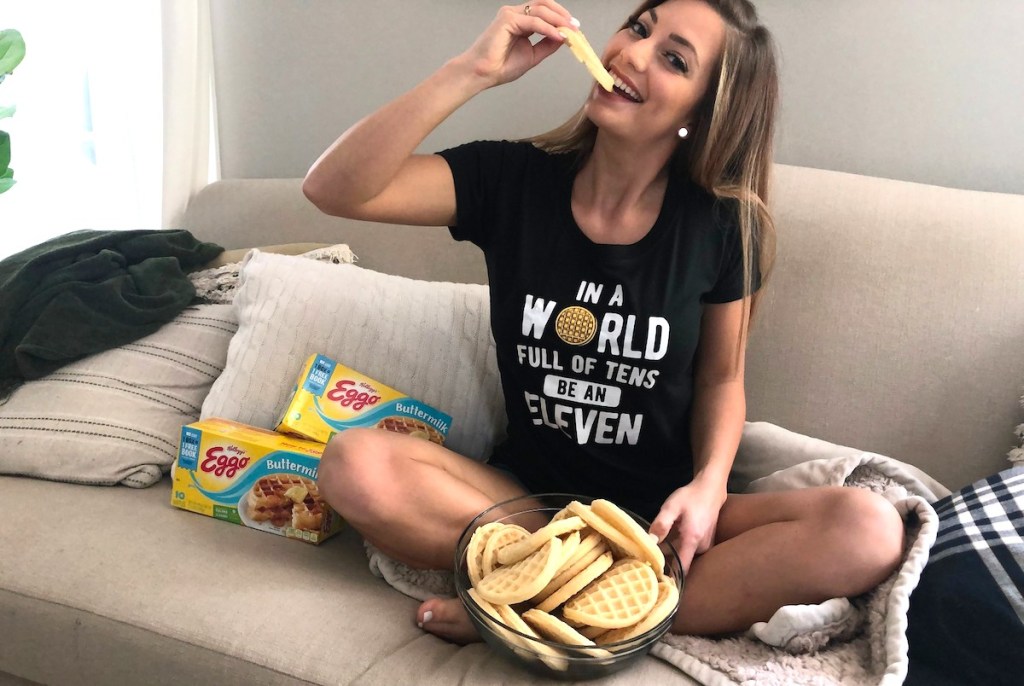 woman eating waffle wearing stranger things shirt