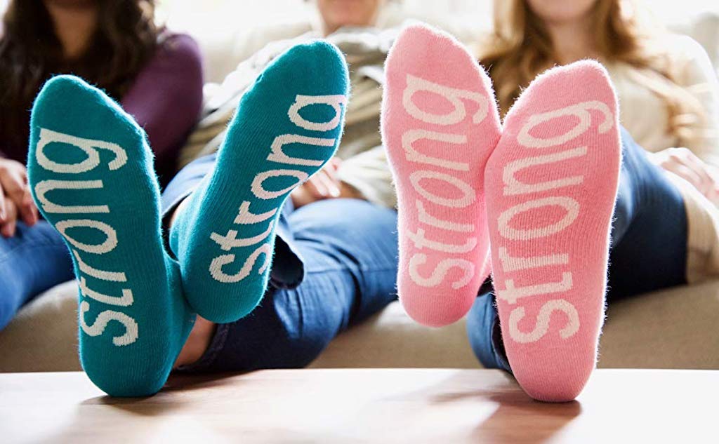 women wearing 'strong' socks that was sent to her in a college care package