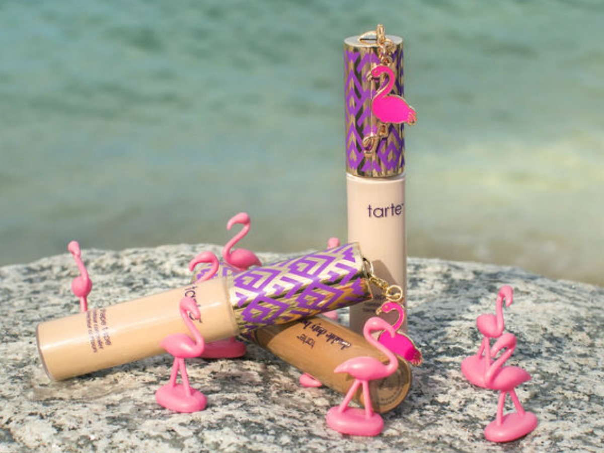 make up with little toy flamingos near beach