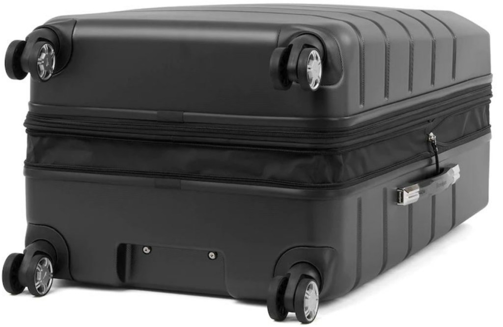 side view of suitcase that is black wheels