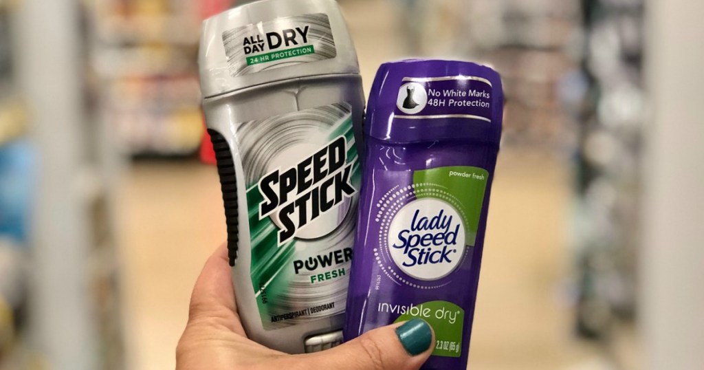 hand holding speed stick and lady speed stick deodorant at walgreens