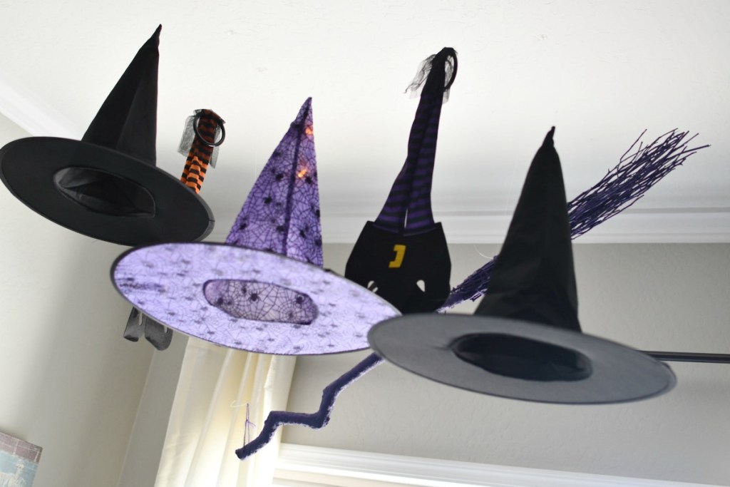 witch hats hanging from ceiling as decor