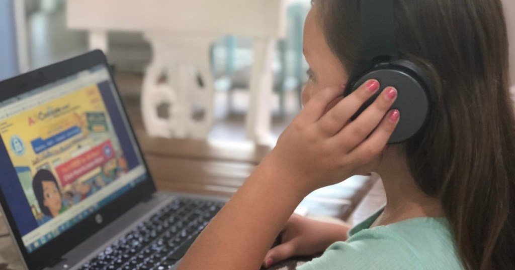 ABC Mouse little girl working on computer wearing headset