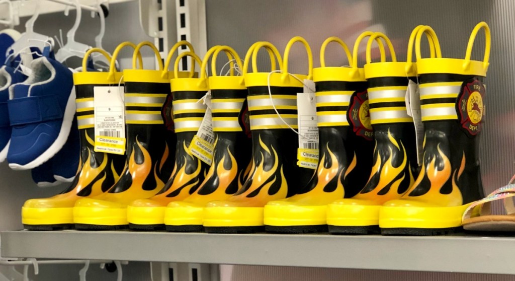 Store shelf of toddler boys rain boots