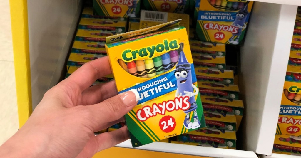 hand holding Crayola Crayons 24 count