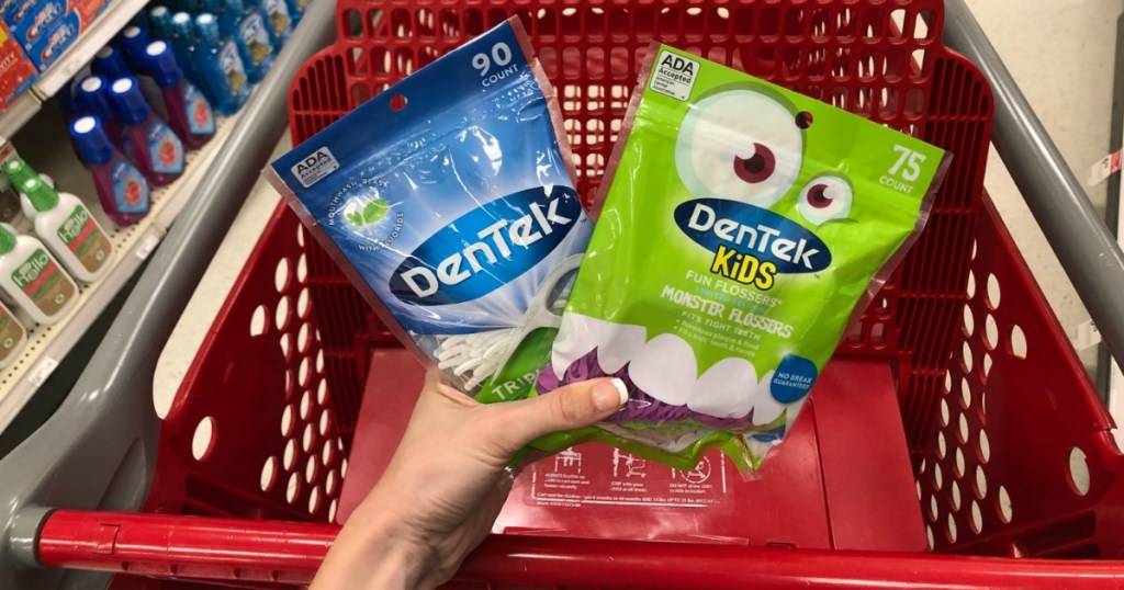 target cart with hand holding dentek flossers