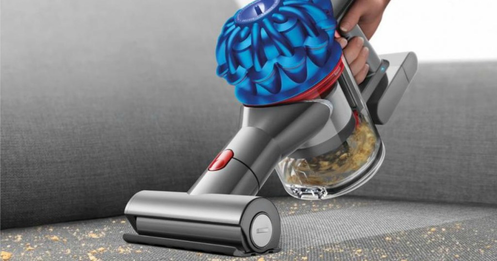 Dyson V7 Trigger Handheld Vacuum vacuuming couch