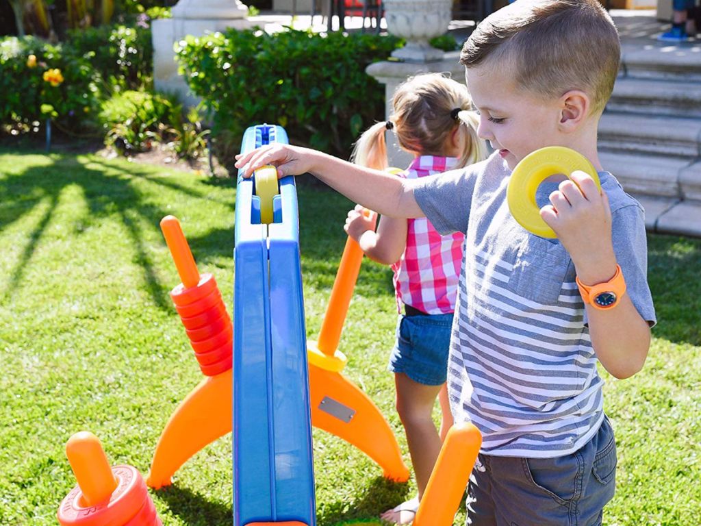 kids playing with ECR4Kids Junior 4-to-Score Giant Game Set in grass
