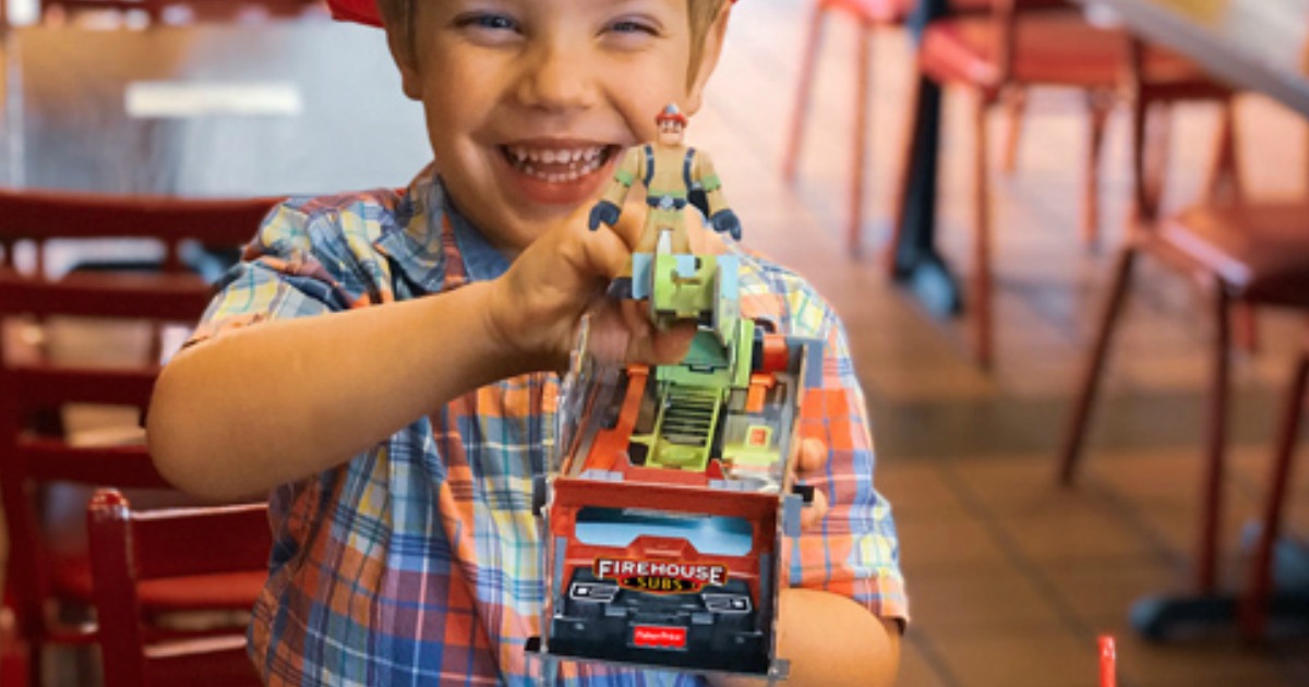 Child playing with Rescue Heroes build-able fire truck in Firehouse Subs restaurant