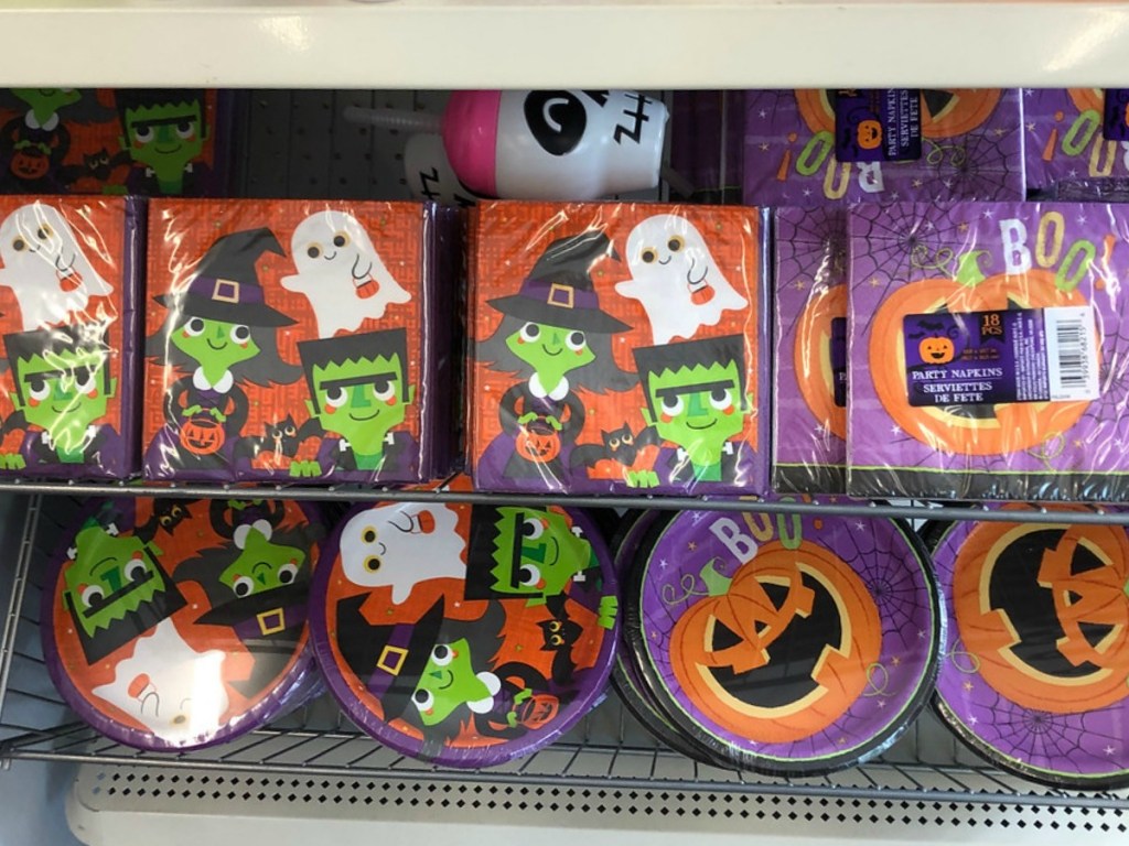 plates and napkins in store with pumpkins and witches on them