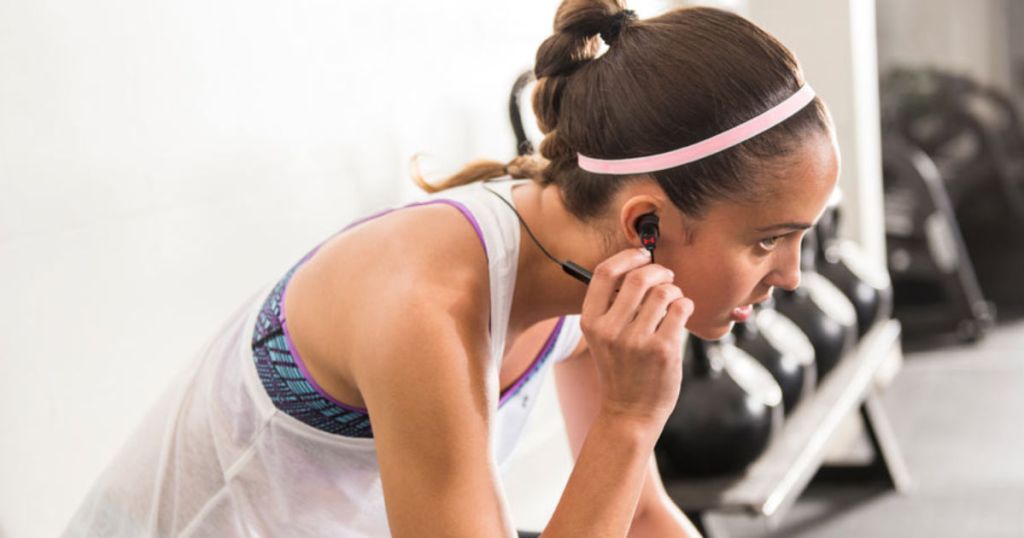 woman wearing JBL Under Armour Sports Wireless