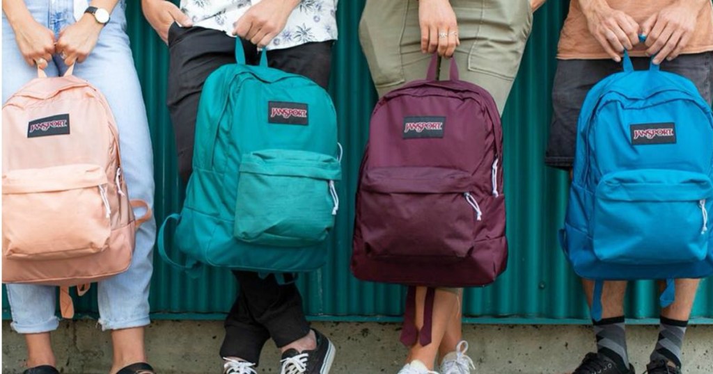 Students holding Jansport backpacks