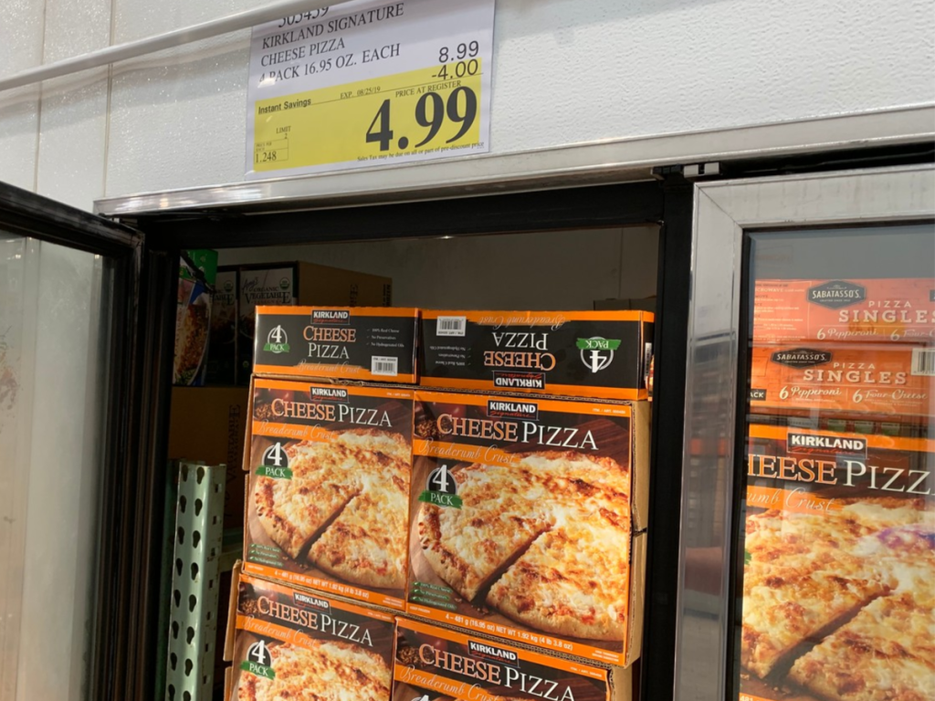 Kirkland Signature Cheese Pizza 4-Pack in Costco with sale sign