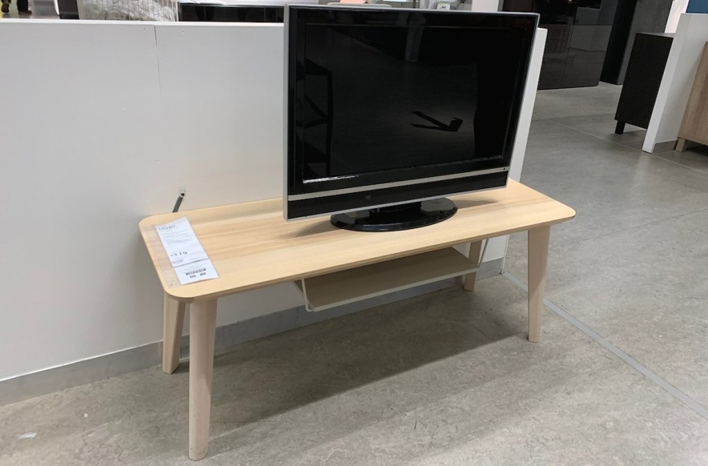 wood TV stand in ikea store