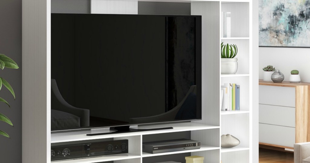 White entertainment stand with large television in living room