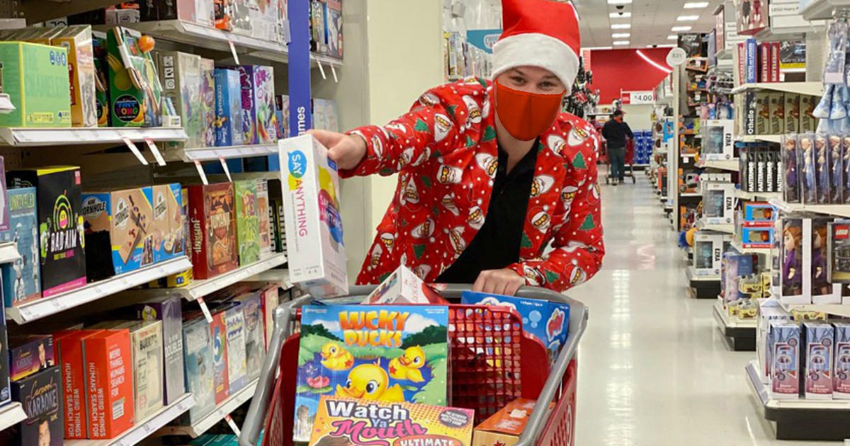 Man wearing santa print suit shopping for Christmas at Target