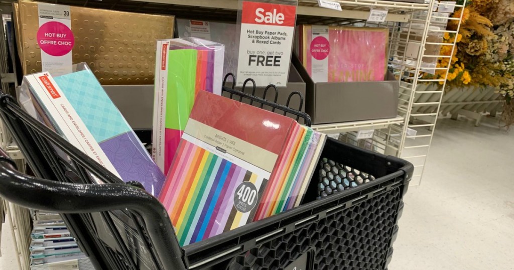 Michaels scrapbooking supplies in a shopping cart