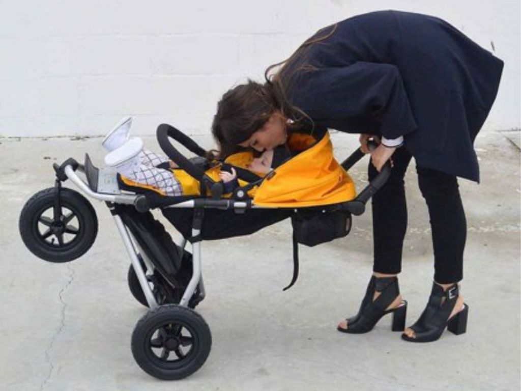 mom kissing baby in Mountain Buggy 2015 Swift Compact Stroller Gold
