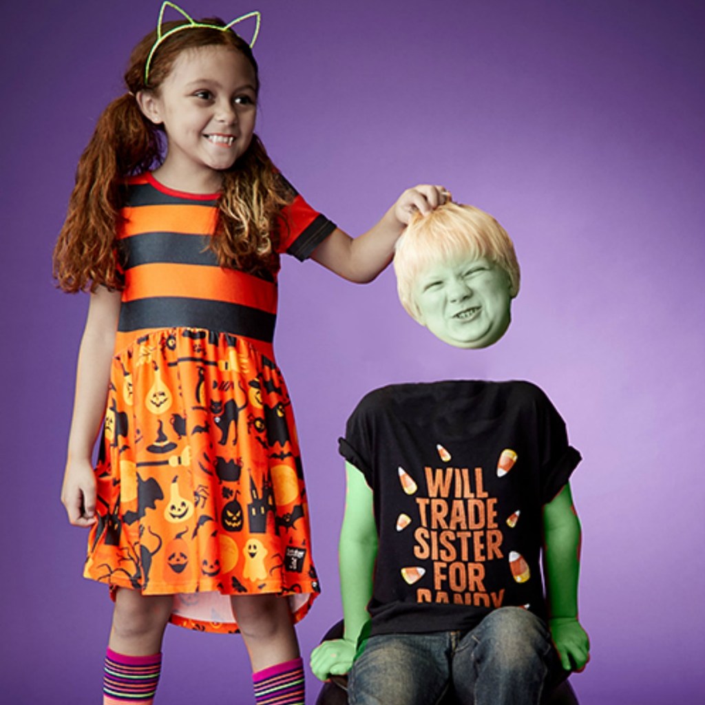 Brother and sister wearing Halloween themed outfits