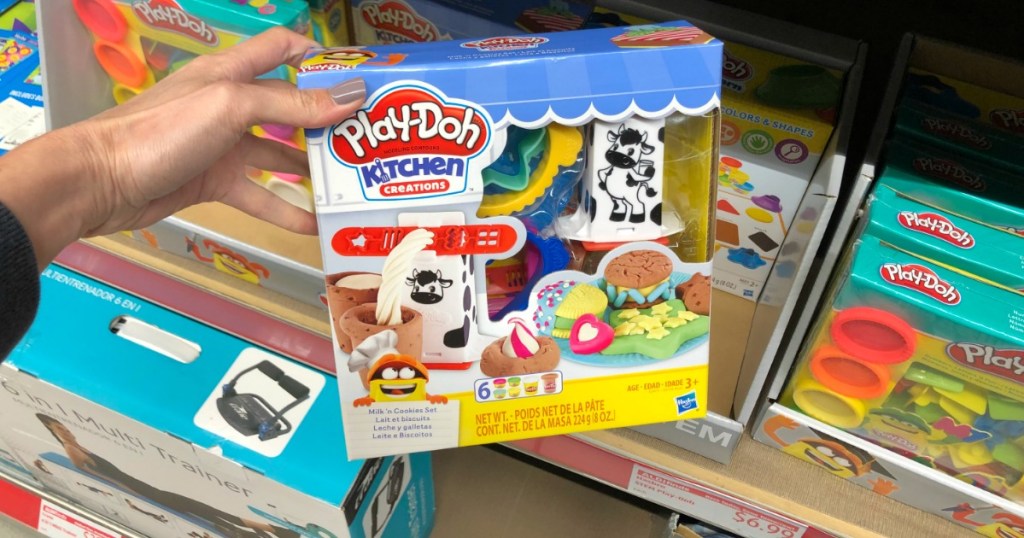 Woman holding Play-Doh Kitchen Creations in ALDI store