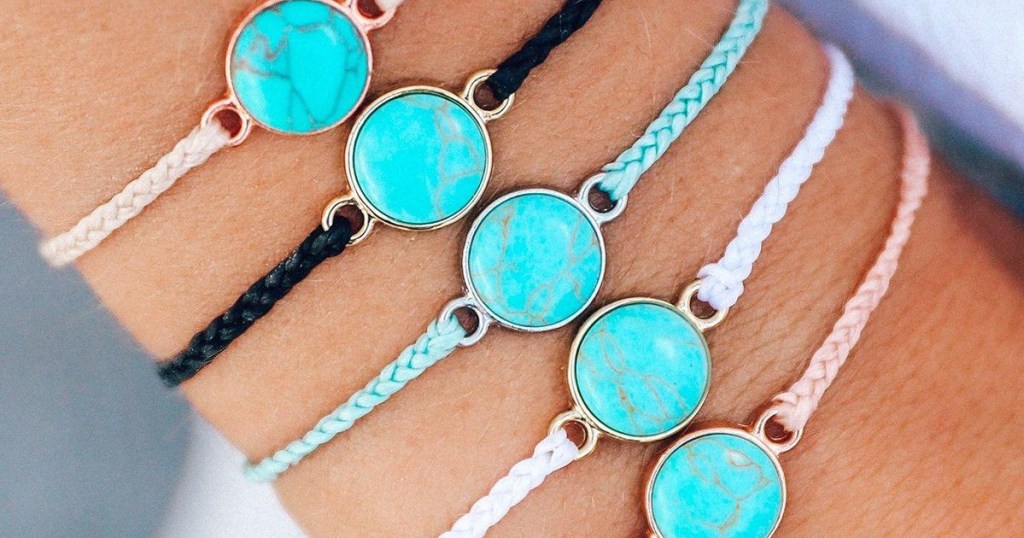 pura vida charm bracelets on arm