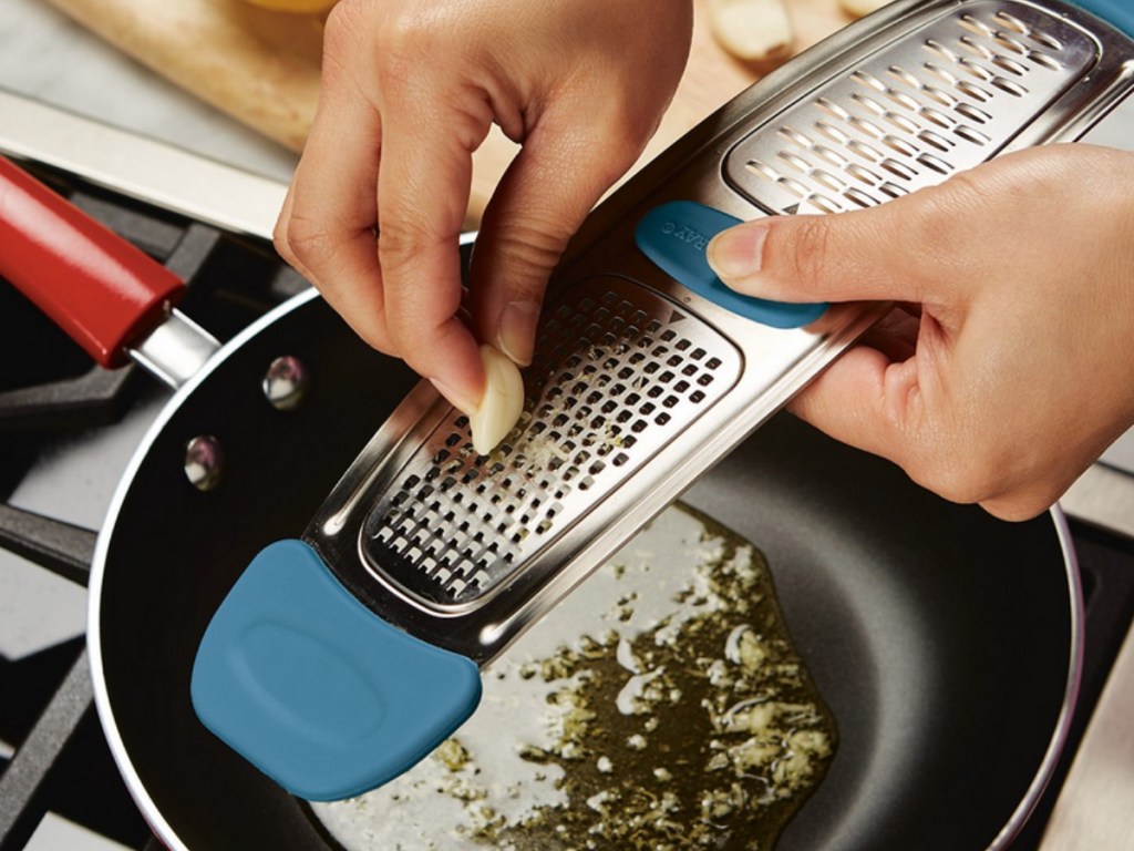 Hand grating garlic with a Rachael Ray Metal Grater