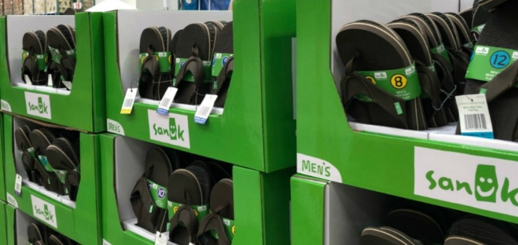 Men's Sanuk Beer Cozy flip flops on display at Costco