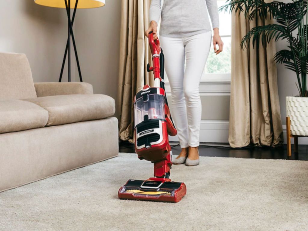 woman vacuuming floor with Shark Navigator Lift-Away Speed Zero-M Self-Cleaning Brushroll Upright Vacuum