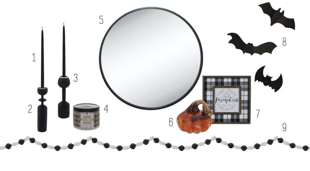 mirror and other various halloween and fall decor on white background