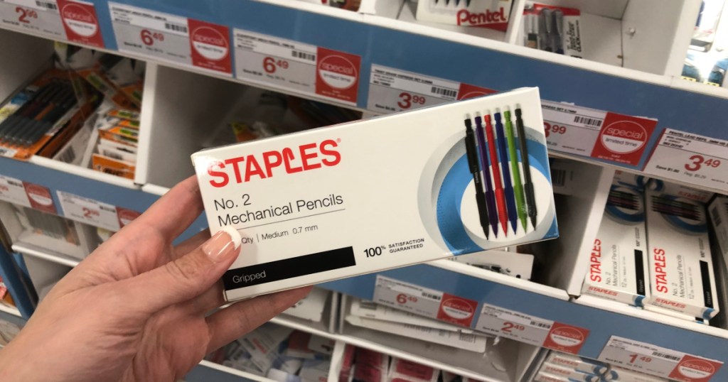 hand holding box of Staples mechanical pencils