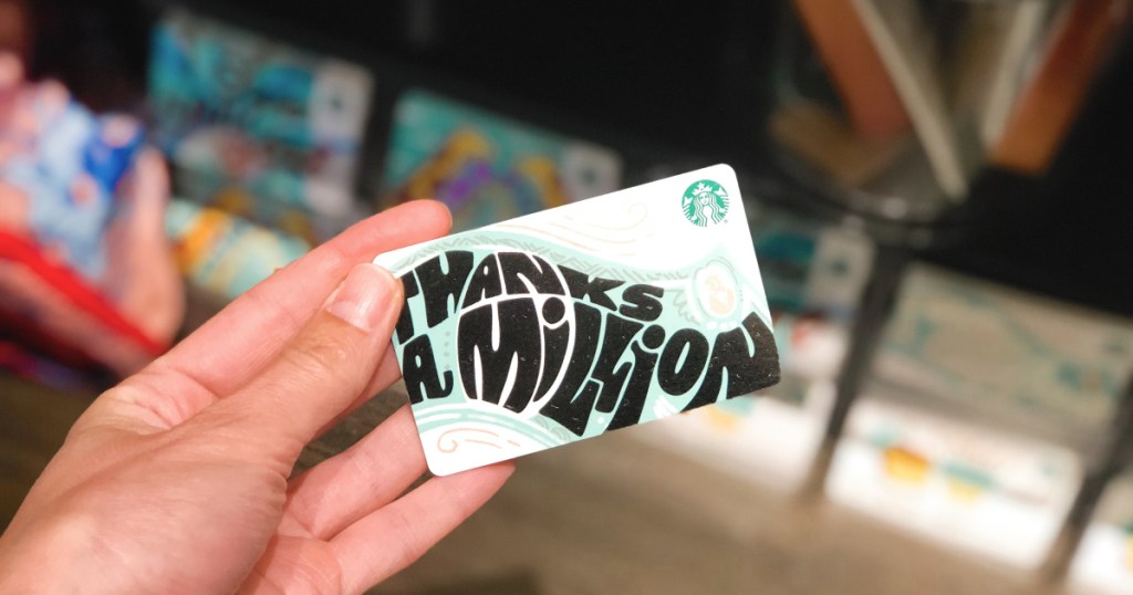 hand holding starbucks gift card