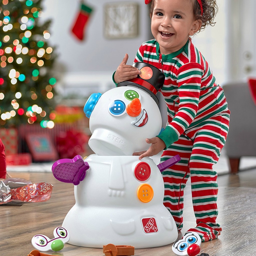 Snowman playset from Step2 near Christmas tree