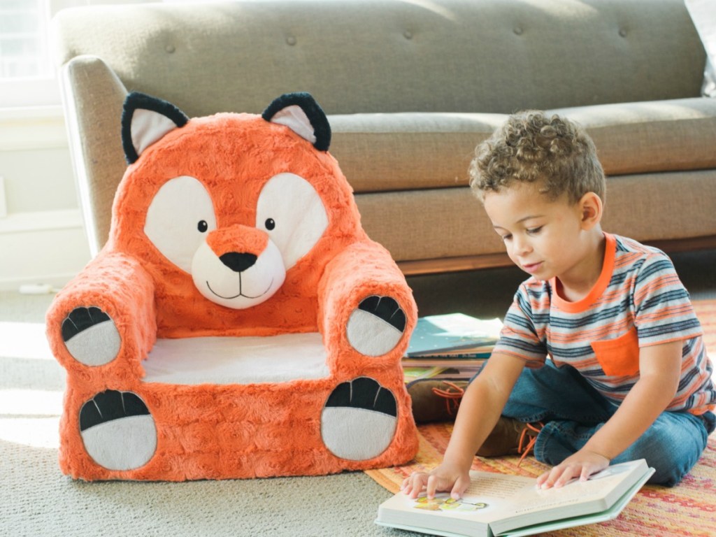 boy on rug next to Sweet Seats Fox Chair