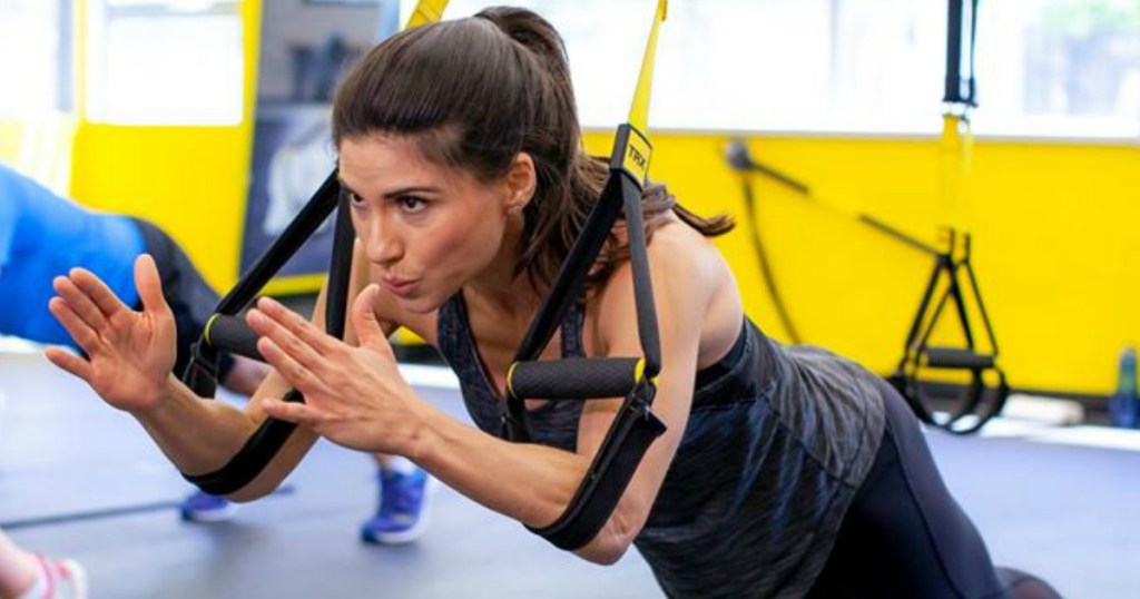 Woman using TRX Training Straps