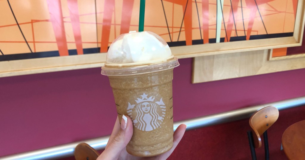 Hand holding Starbucks Frappuccino at Target Starbucks