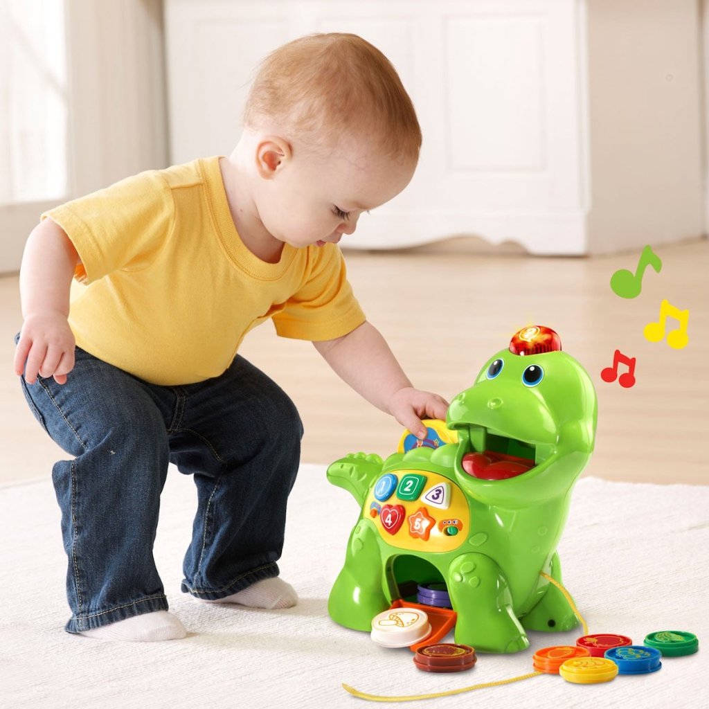 kid playing with Vtech Dino