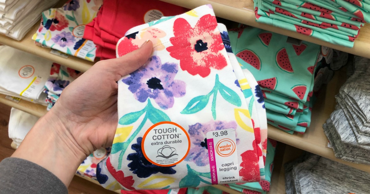 hand holding capri leggings