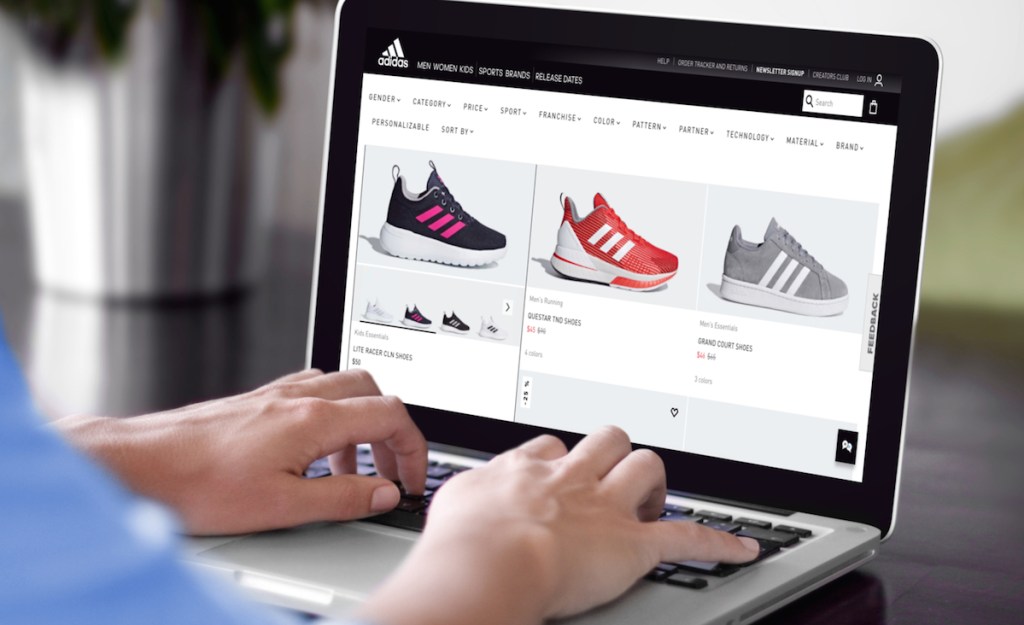 laptop screen with adidas shoes sale on it