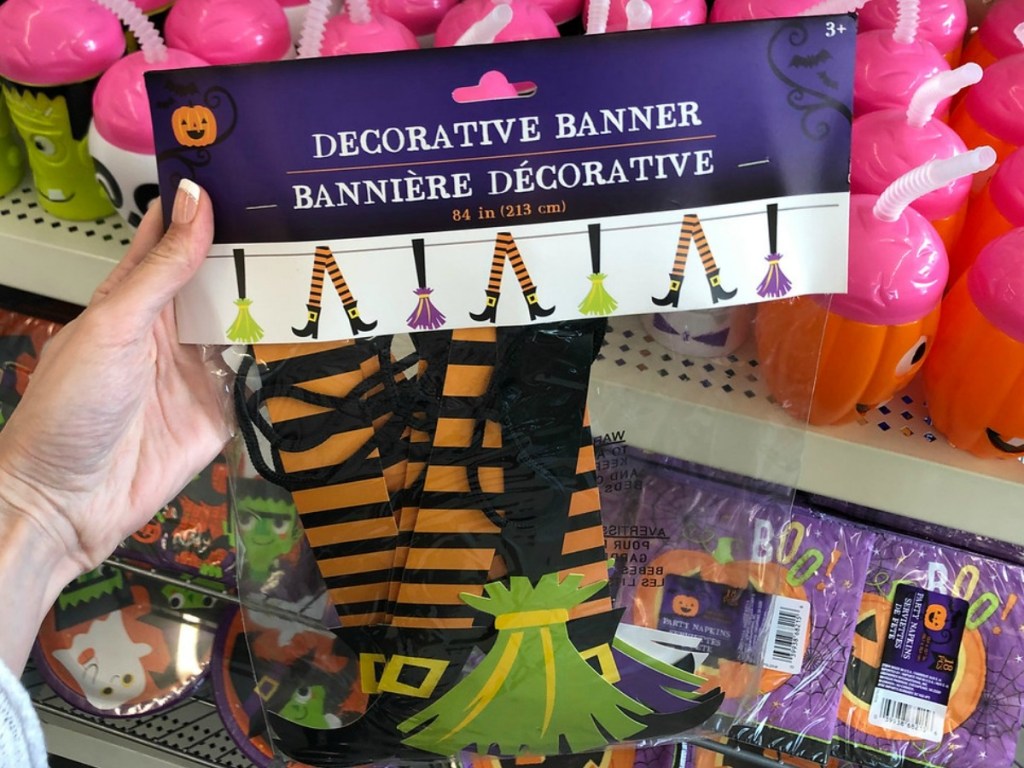 hand holding package with halloween banner