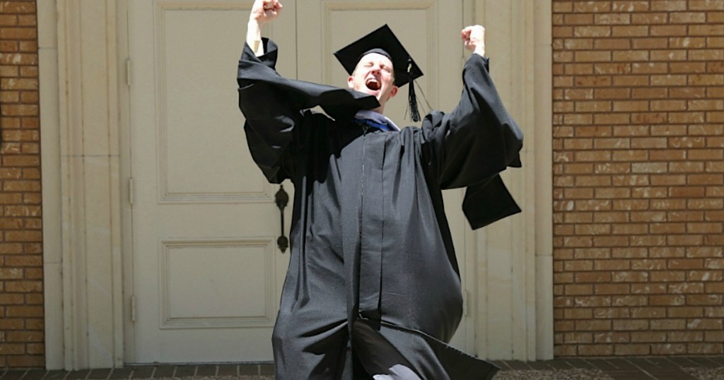 College graduate showing excitement 
