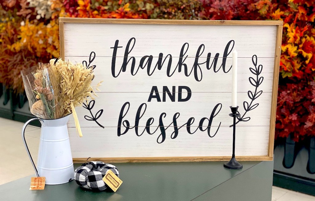 thankful and blessed sign in store with various fall decor