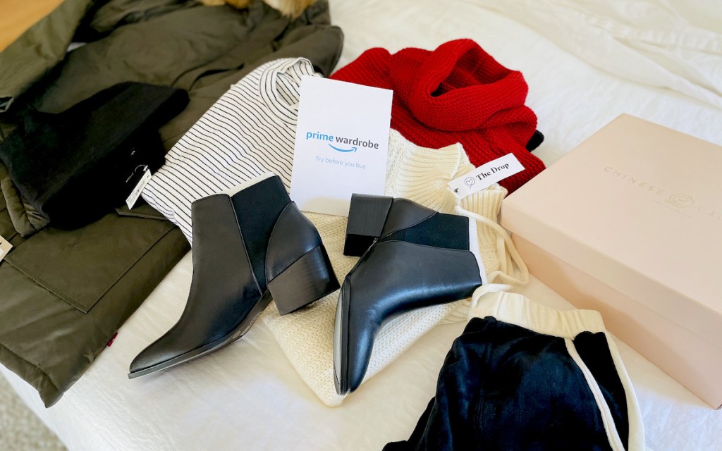 amazon personal shopper clothes and booties laying on bed