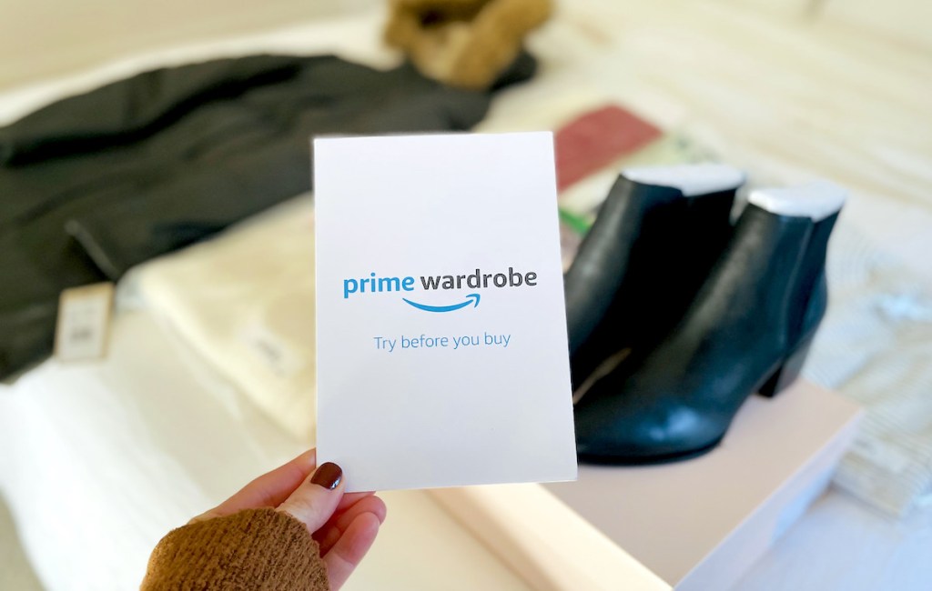 hand holding a prime wardrobe pamphlet