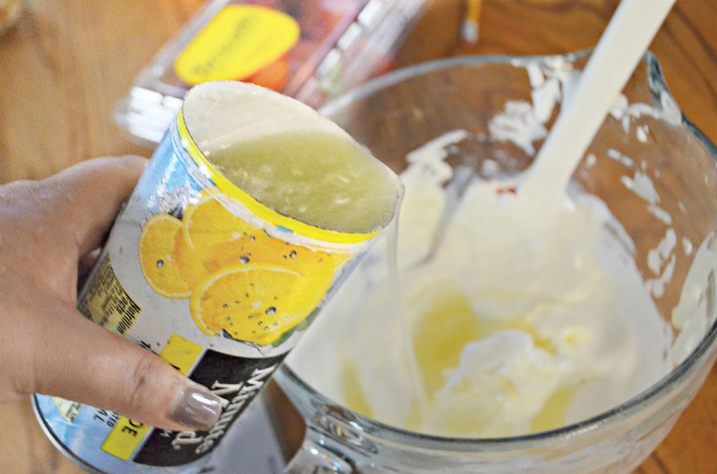 pouring lemonade concentrate into fluff